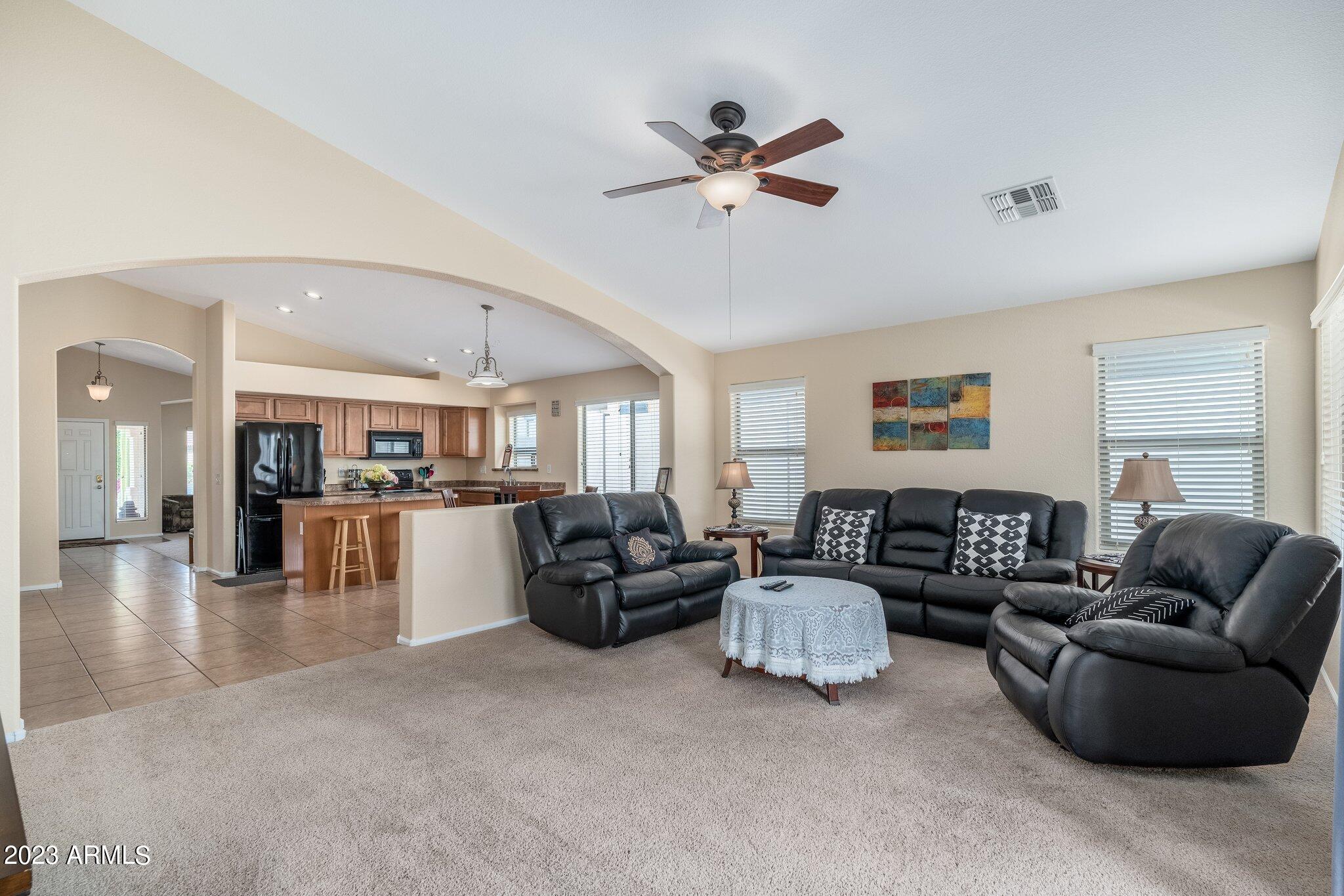 2215 West Peak View Road Phoenix, AZ 85085 - Photo 17 of 49 a living room with furniture and a ceiling fan