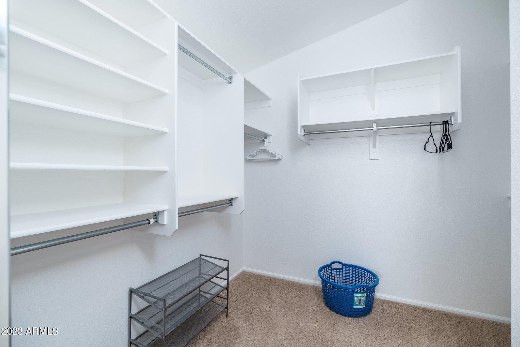 2215 West Peak View Road Phoenix, AZ 85085 - Photo 25 of 49 a view of an empty walk in closet
