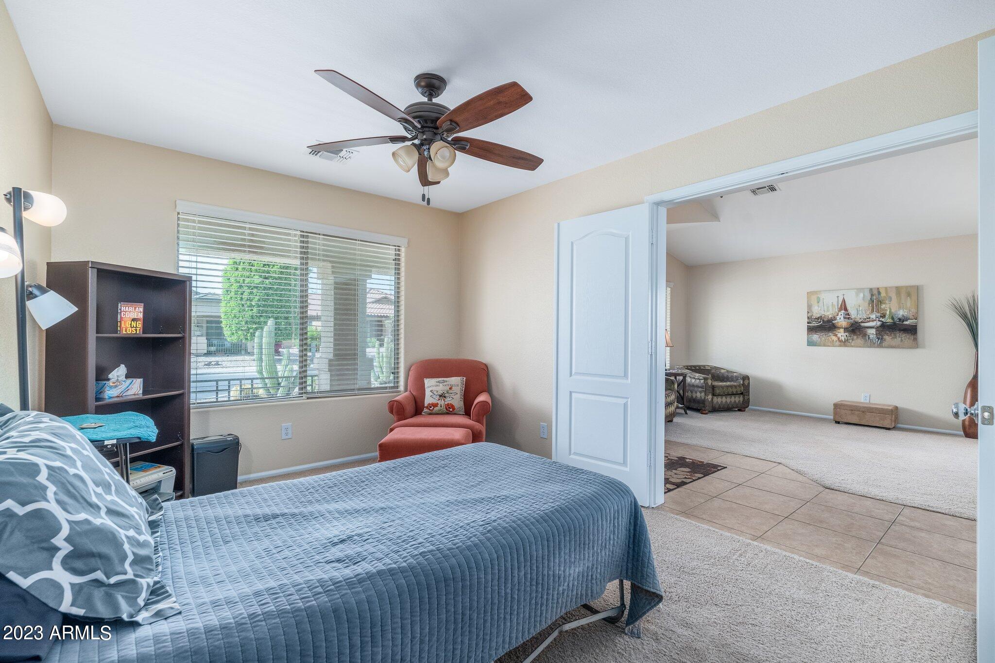 2215 West Peak View Road Phoenix, AZ 85085 - Photo 28 of 49 a bedroom with a large bed and a window