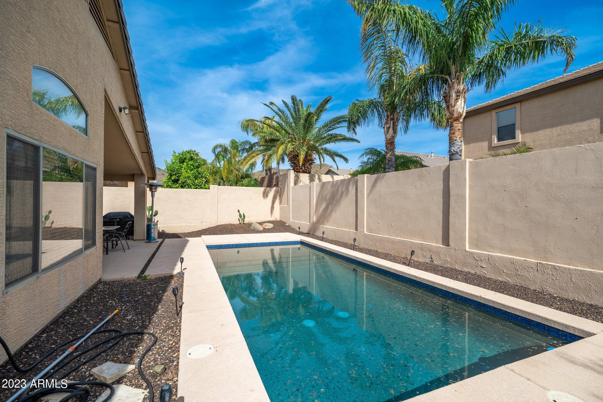 2215 West Peak View Road Phoenix, AZ 85085 - Photo 33 of 49 a house view with a swimming pool