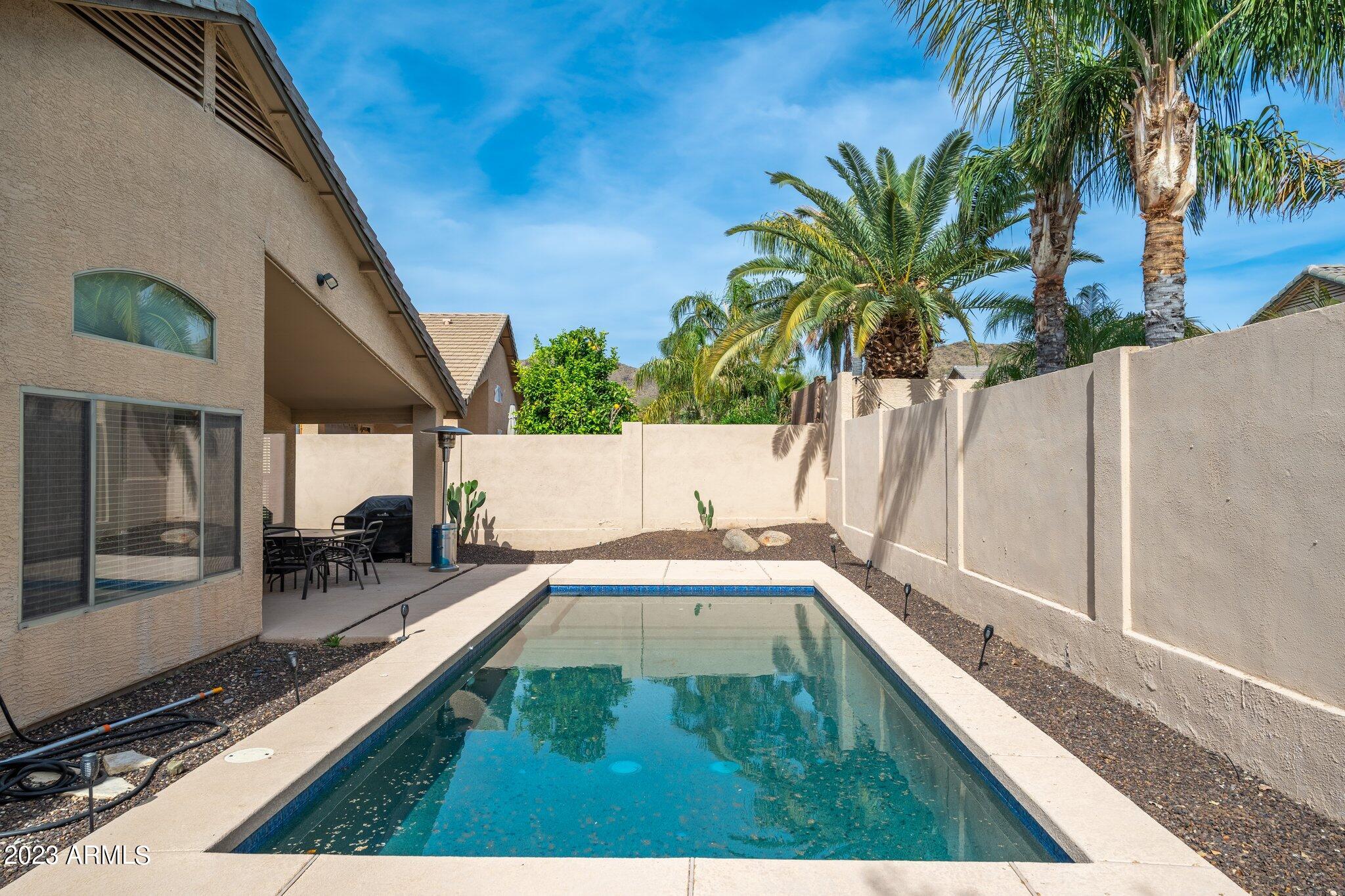 2215 West Peak View Road Phoenix, AZ 85085 - Photo 34 of 49 a picture of a living room with a balcony