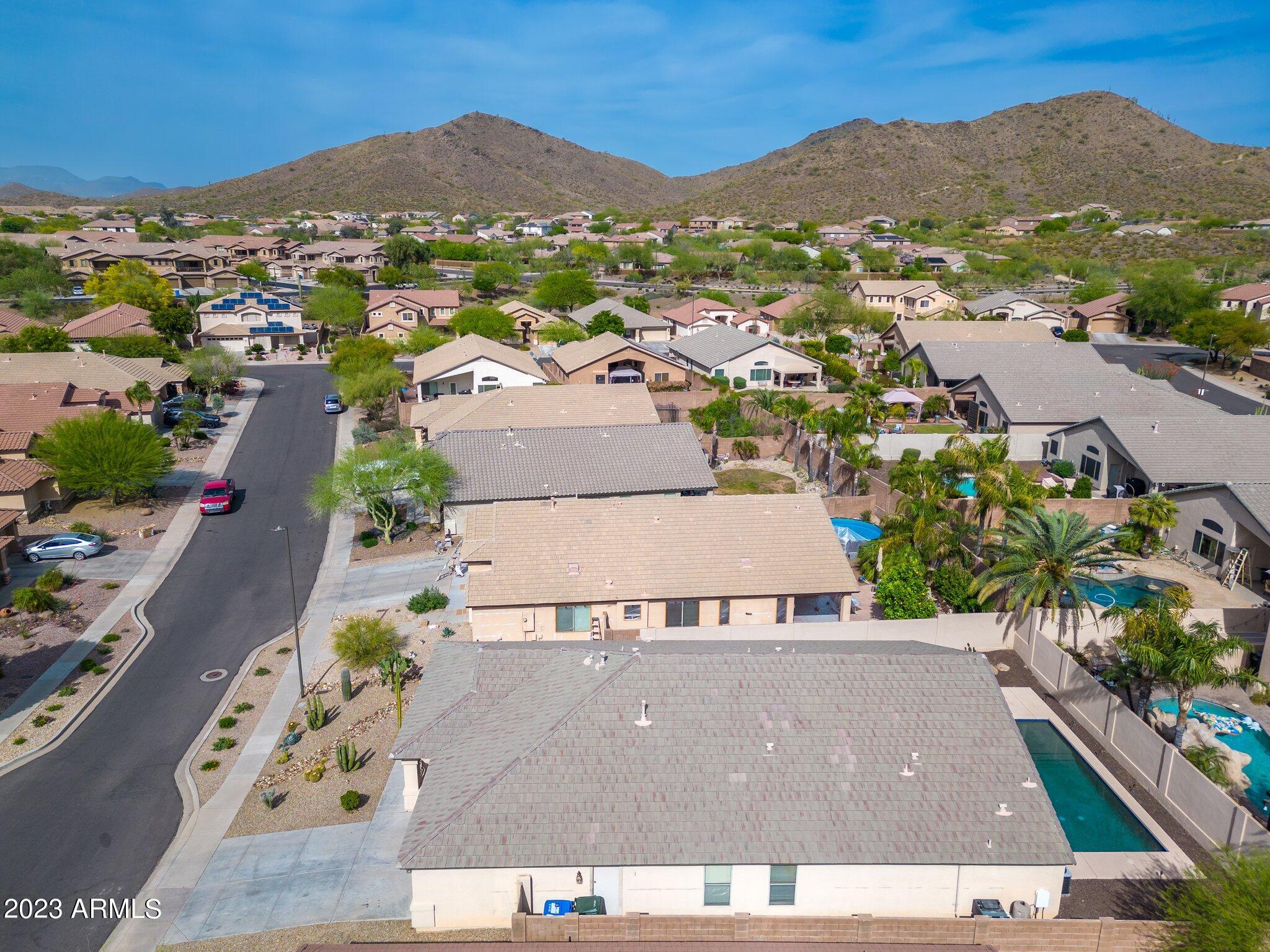 2215 West Peak View Road Phoenix, AZ 85085 - Photo 42 of 49 an aerial view of residential houses with outdoor space and street view