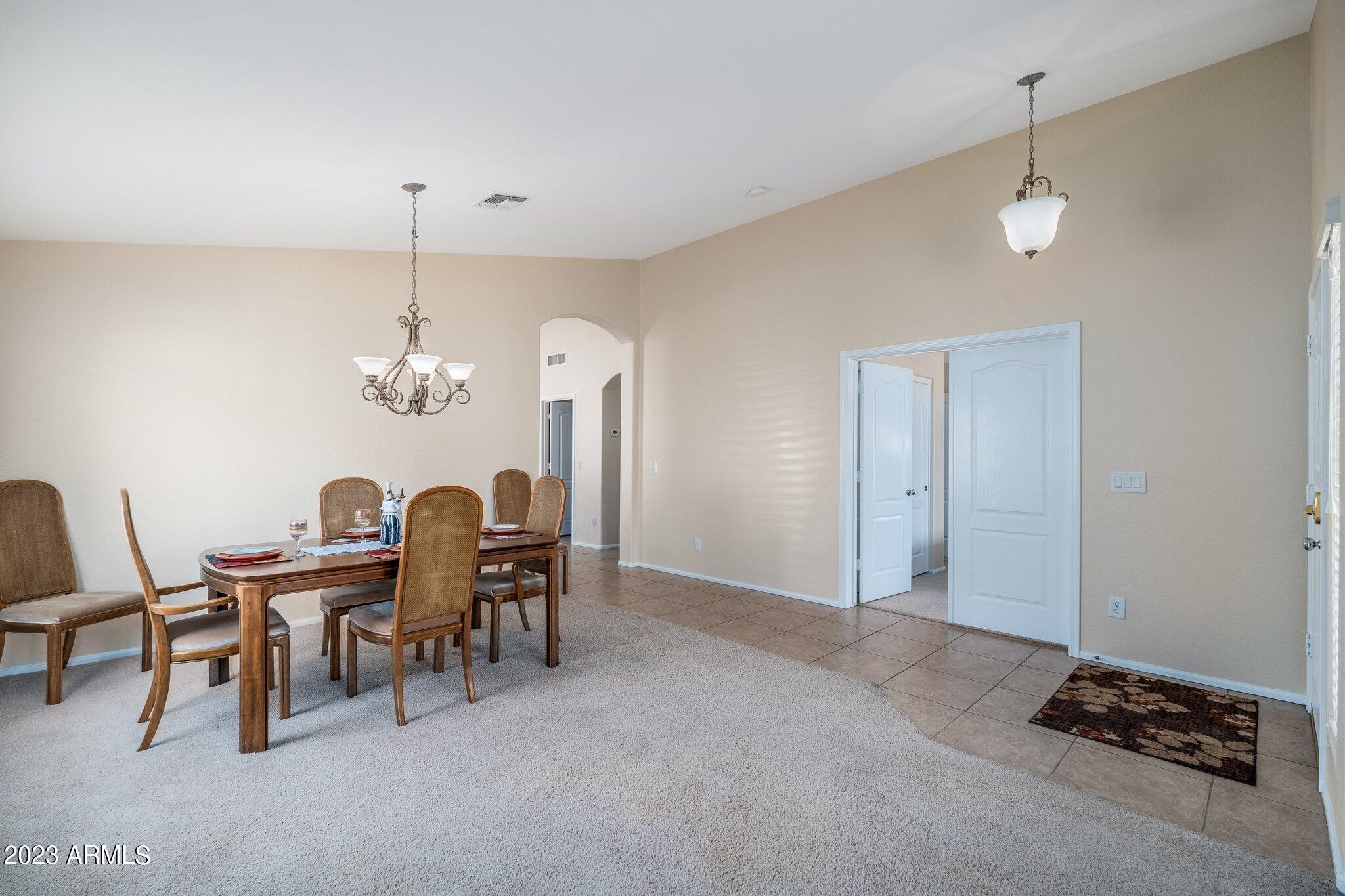 2215 West Peak View Road Phoenix, AZ 85085 - Photo 6 of 49 a view of a dining room with furniture