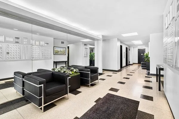 a living room with furniture and white walls