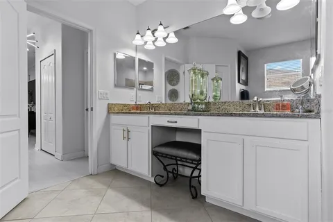 a kitchen with stainless steel appliances granite countertop a stove refrigerator and a sink