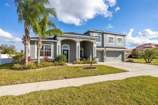 a front view of a house with a yard