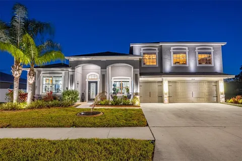 a living room with furniture and flat screen tv