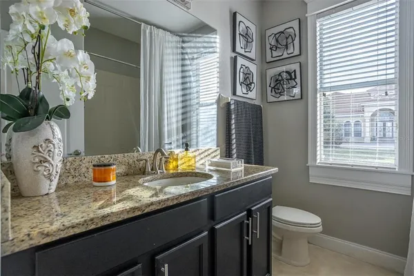 a kitchen with a stove and a shower