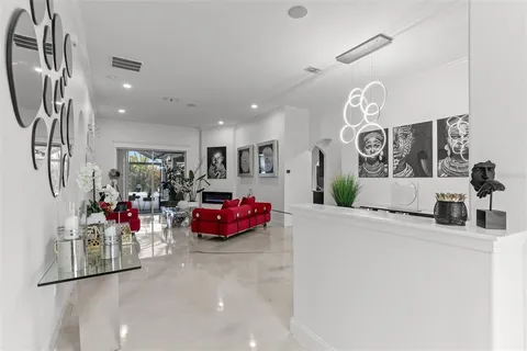 a kitchen with a sink and chandelier