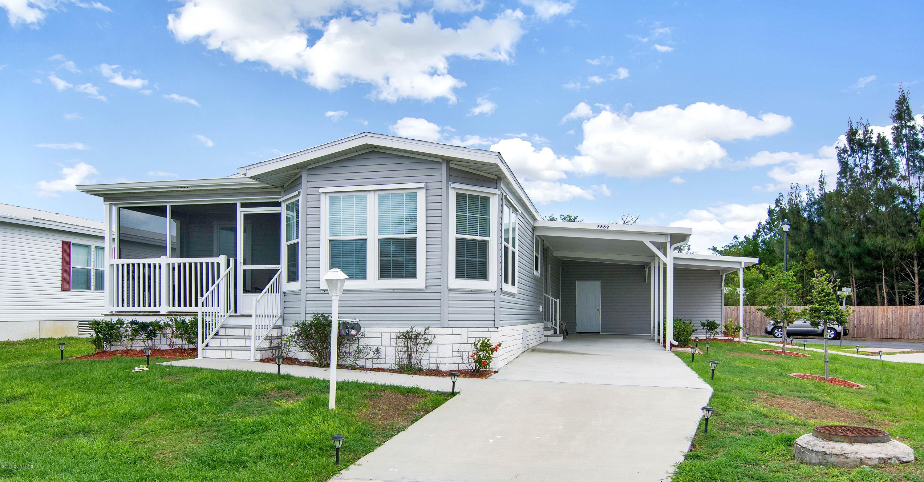 7669 Cedar Bark Road Micco, FL 32976 - Photo 1 of 22 front of home