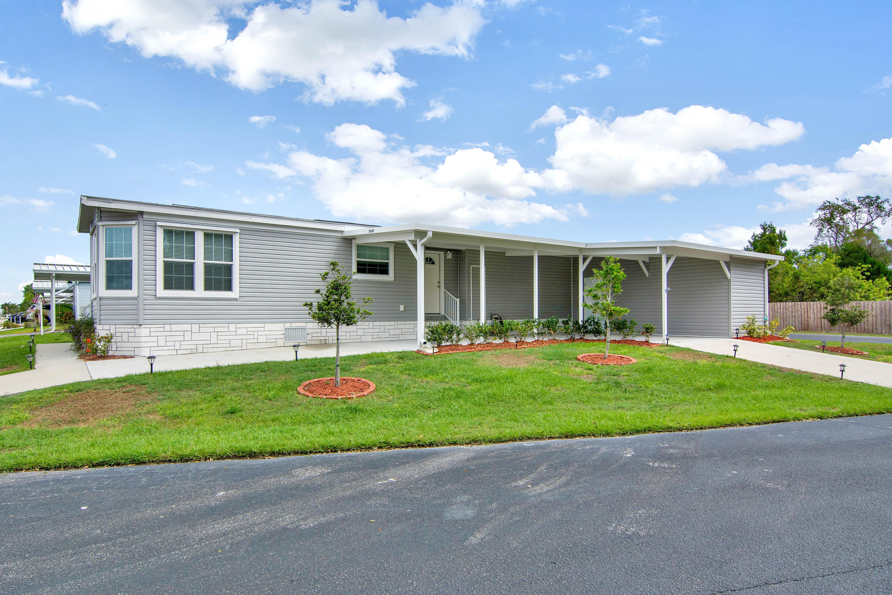 7669 Cedar Bark Road Micco, FL 32976 - Photo 2 of 22 side of home