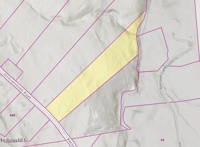 a close up of hanging light and a wall