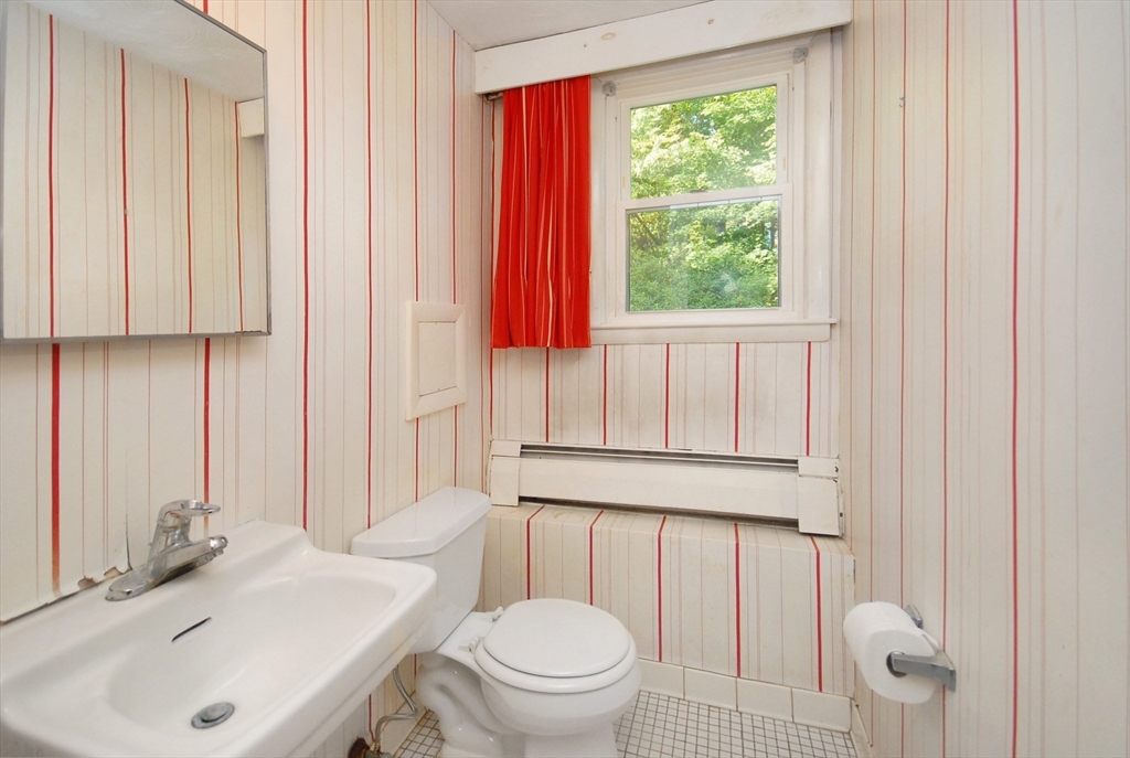 13 Beverly Road Acton, MA 01720 - Photo 15 of 23 a bathroom with a sink toilet and shower