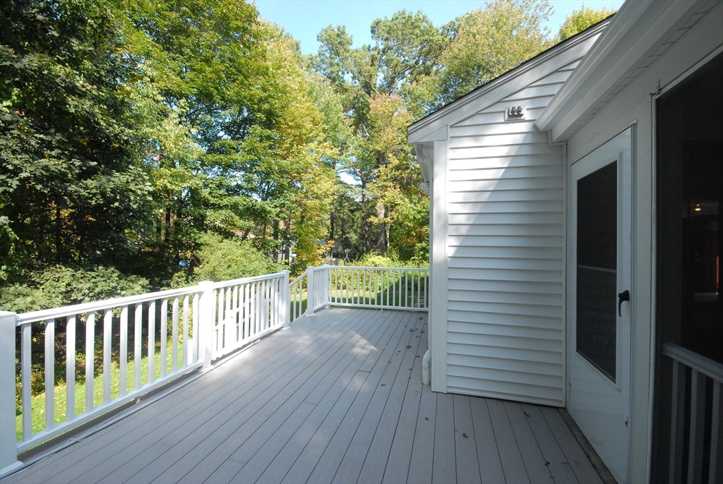 13 Beverly Road Acton, MA 01720 - Photo 19 of 23 a view of a deck with two chair and wooden floor