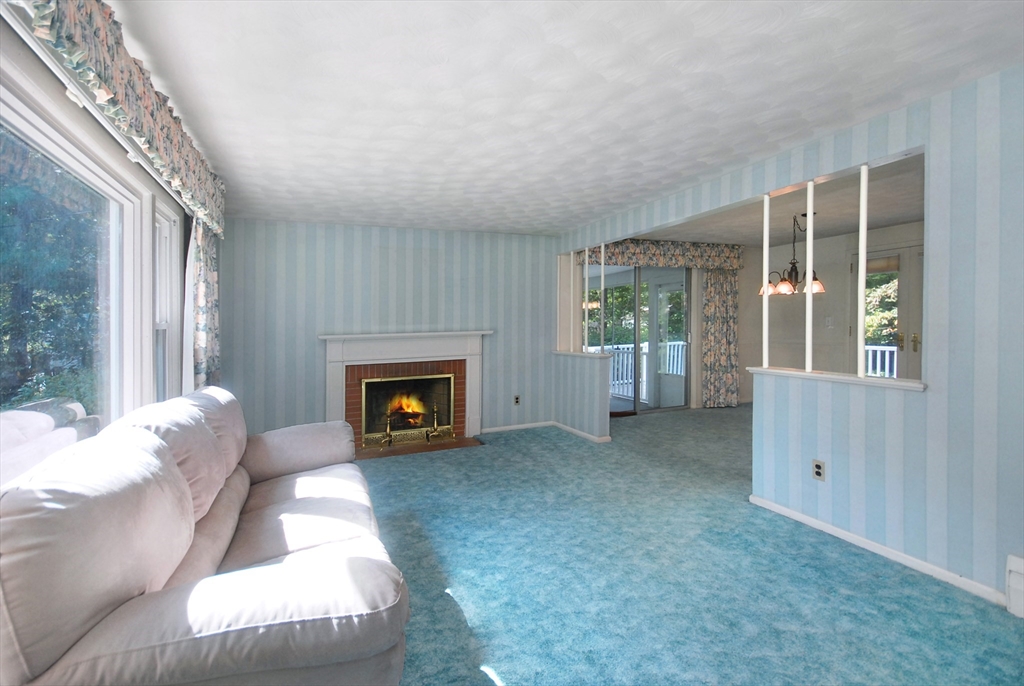 13 Beverly Road Acton, MA 01720 - Photo 6 of 23 a view of a livingroom with a fireplace and window