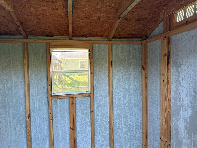 a view of a hallway with a window