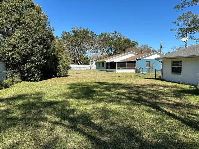 a view of a house with a big yard