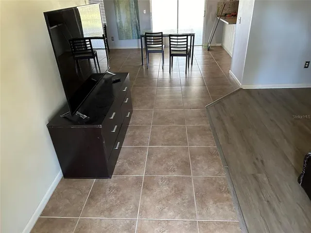 a view of kitchen with furniture and wooden floor
