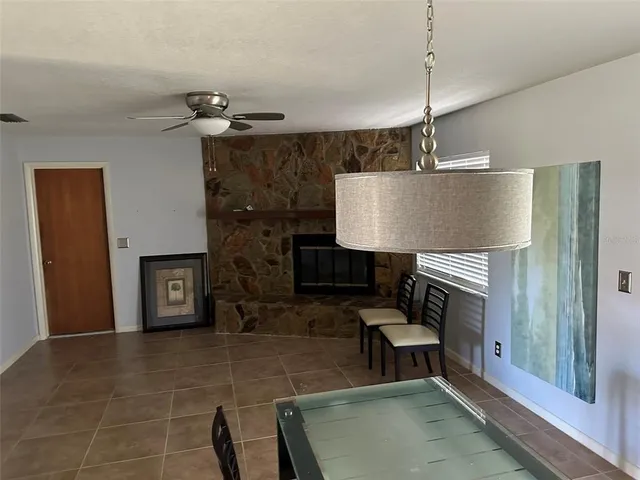 a living room with furniture a table and a fireplace