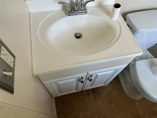 a bathroom with a sink and mirror