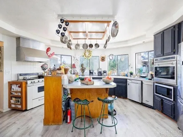 a view of a kitchen and dining room
