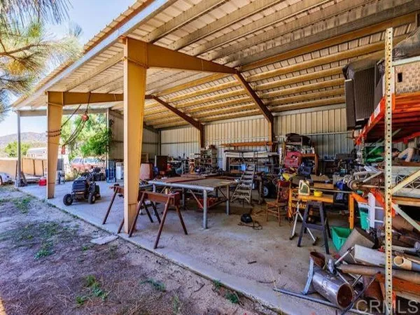 a view of a tables and chairs in a patio