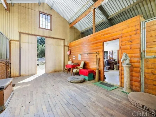 a view of a porch with wooden floor