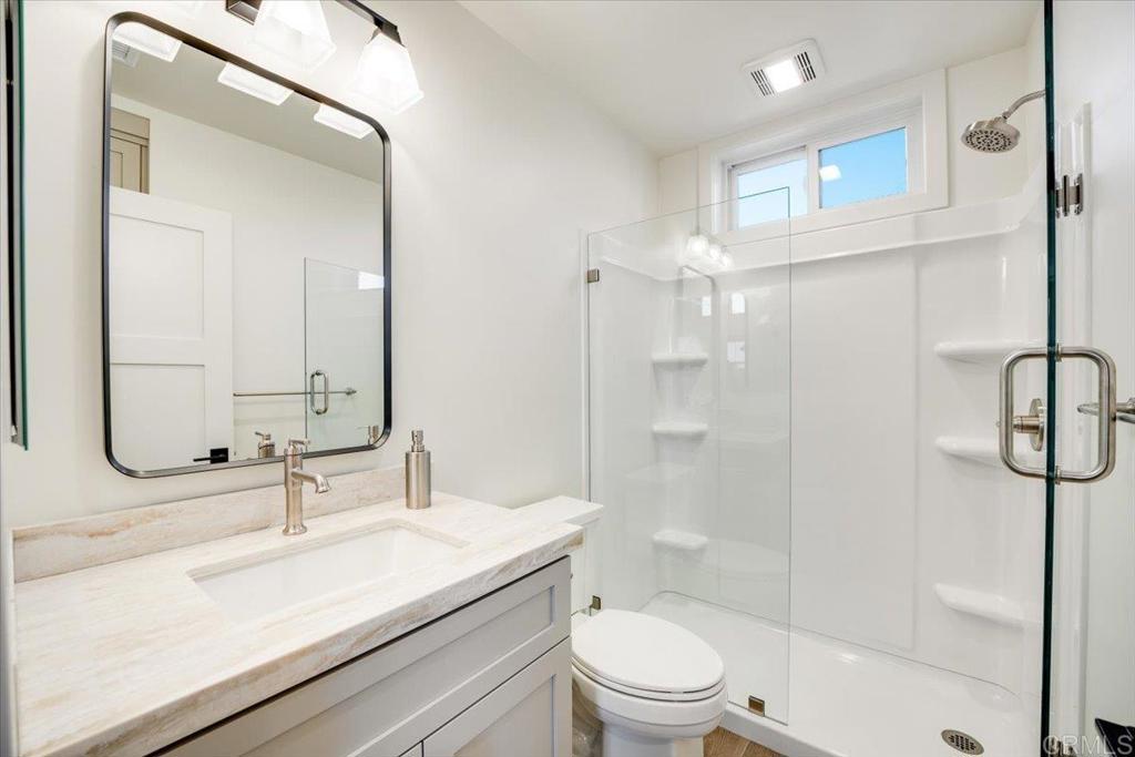 337 D Street Ramona, CA 92065 - Photo 14 of 26 a bathroom with a sink a toilet and shower