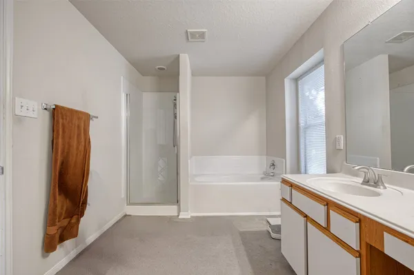 a bathroom with a bathtub and a sink
