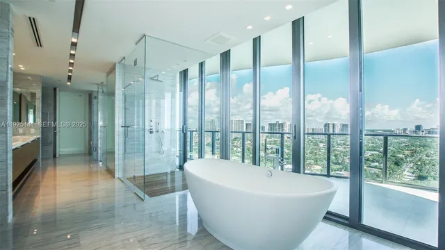 a bathroom with a bathtub and a shower