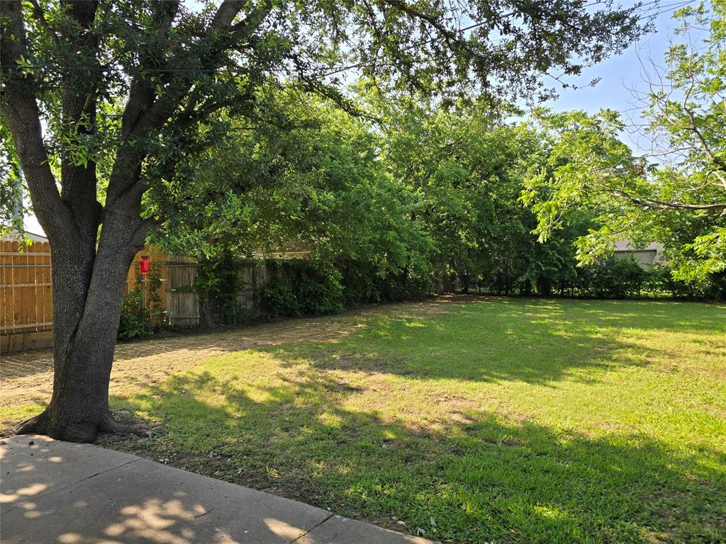1000 Springdale Road Bedford, TX 76021 - Photo 33 of 36 Spacious backyard on a corner lot. Conveniently located less than one block from Shady Brook Elementary School.