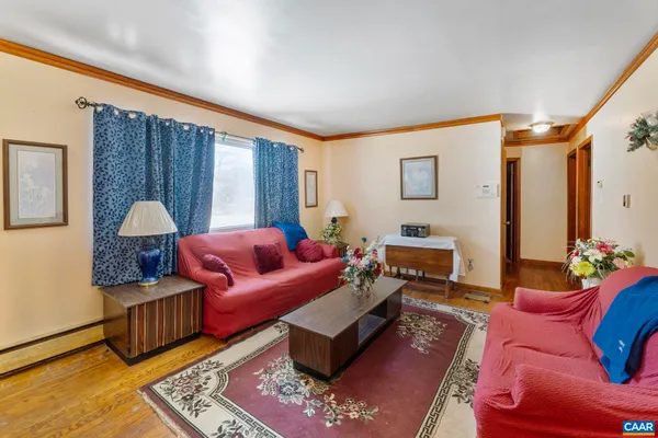 a living room with furniture and a rug