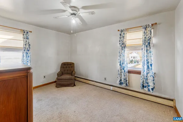 a view of livingroom with window and ceiling fan
