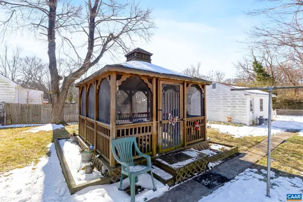 a view of a porch with wooden floor