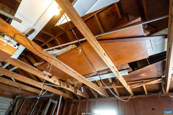 a front view of a house with a yard covered in snow