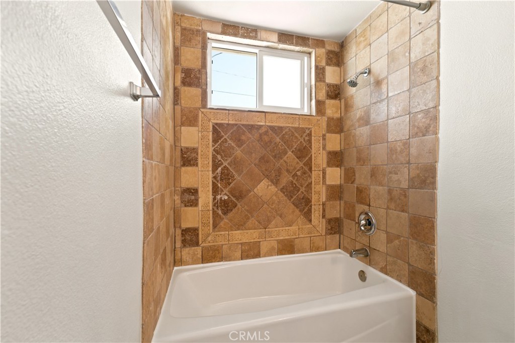 1720 Anderson Street Simi Valley, CA 93065 - Photo 22 of 30 a bathroom with a bathtub and shower