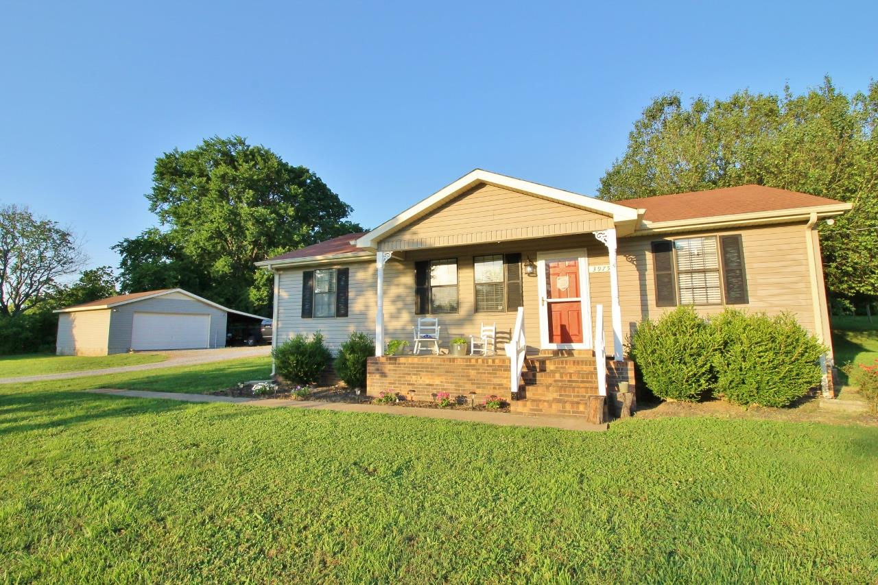 3975 Beasleys Bend Road Lebanon, TN 37087 - Photo 1 of 25 a front view of a house with yard and green space