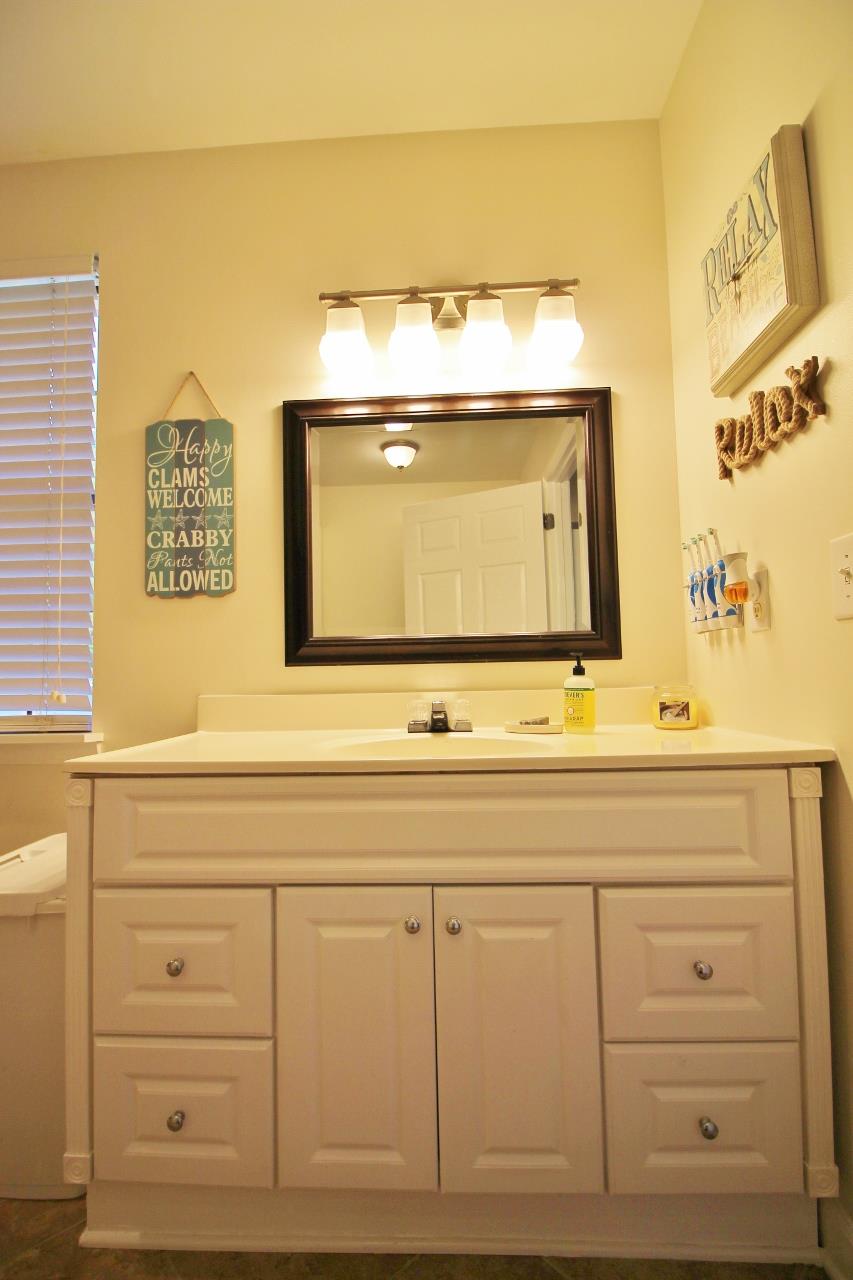 3975 Beasleys Bend Road Lebanon, TN 37087 - Photo 14 of 25 a bathroom with a sink mirror and vanity