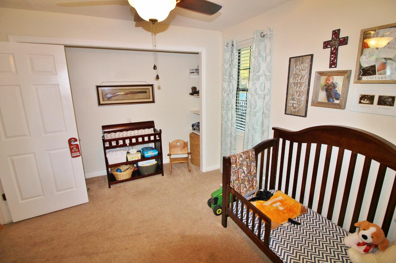 3975 Beasleys Bend Road Lebanon, TN 37087 - Photo 17 of 25 a view of a bedroom with furniture wooden floor and window