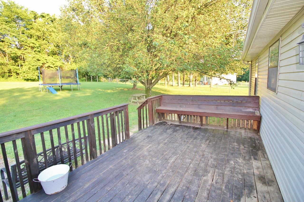 3975 Beasleys Bend Road Lebanon, TN 37087 - Photo 23 of 25 a view of a chairs and table on the wooden deck