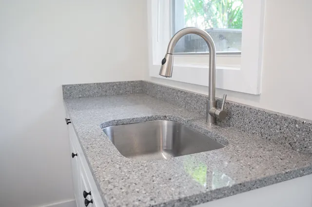 a bathroom with a bathtub and shower
