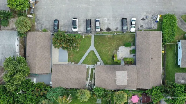 an aerial view of a house with outdoor space