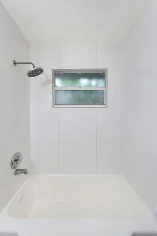 an aerial view of a house with a yard and sitting area