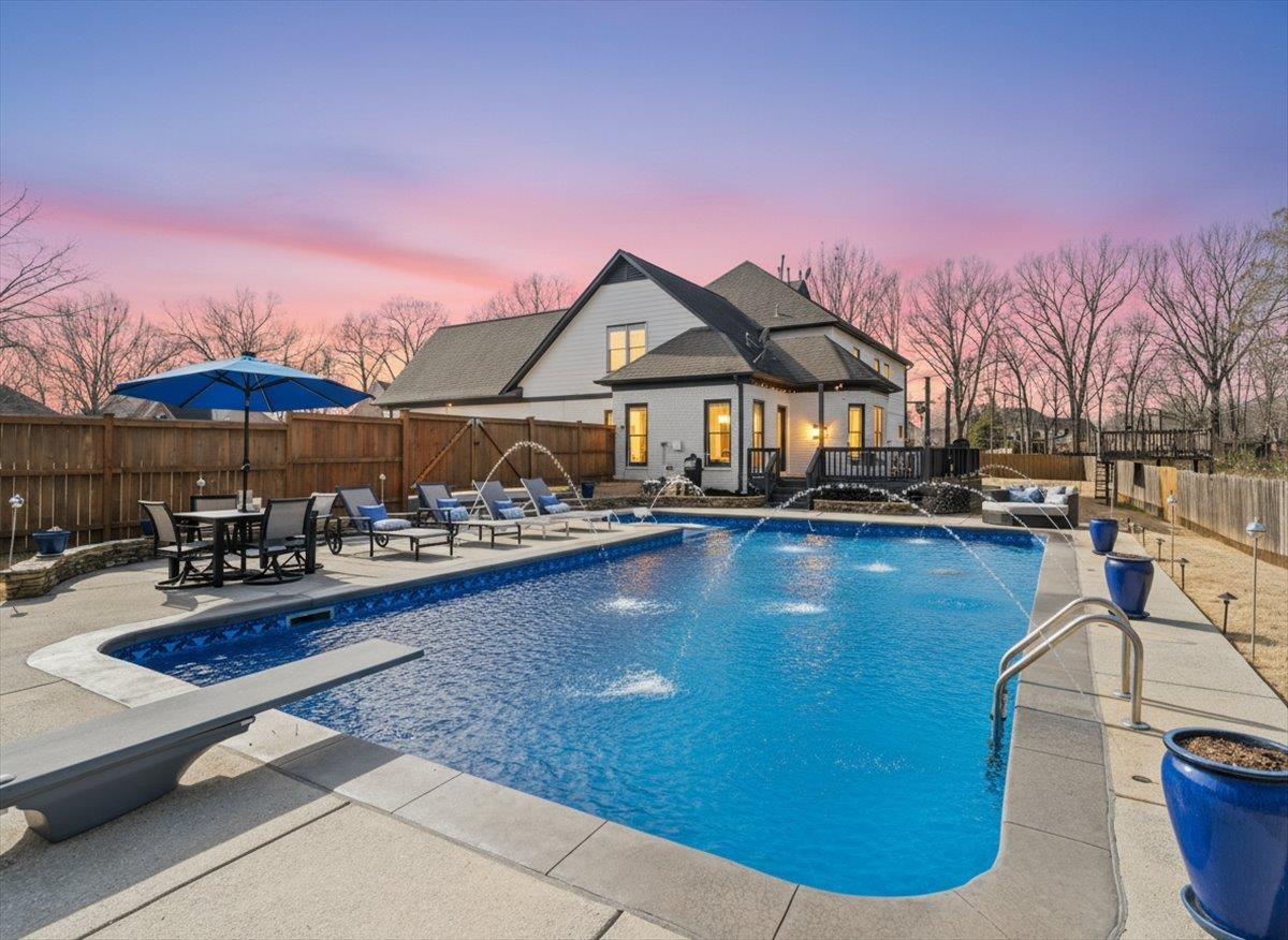 a view of swimming pool with outdoor seating and a potted plants