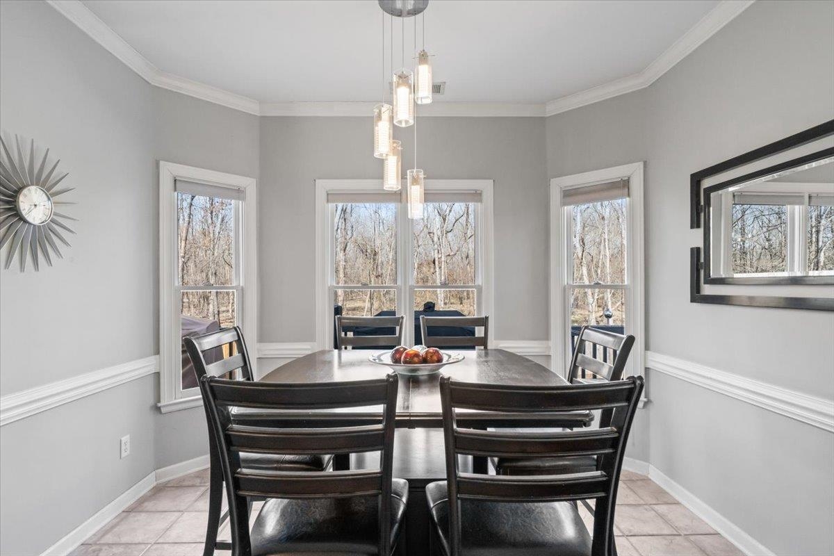1804 Lisson Lane Collierville, TN 38017 - Photo 13 of 35 a view of a dining room with furniture window and outside view