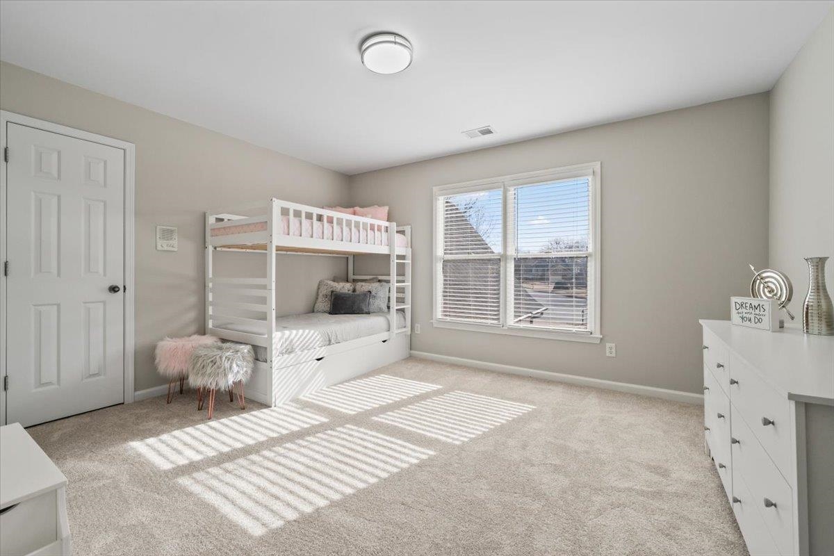 1804 Lisson Lane Collierville, TN 38017 - Photo 30 of 35 a spacious bedroom with a large bed and a window