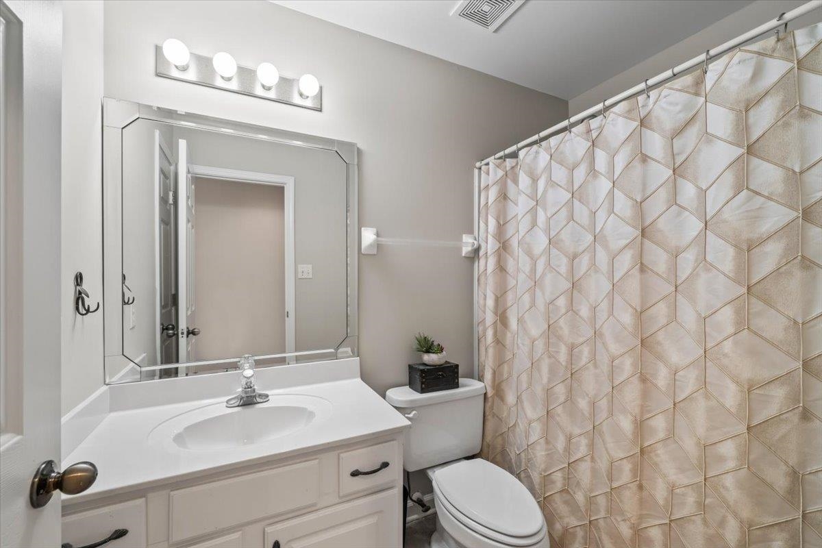 1804 Lisson Lane Collierville, TN 38017 - Photo 31 of 35 a bathroom with a granite countertop sink mirror vanity and toilet