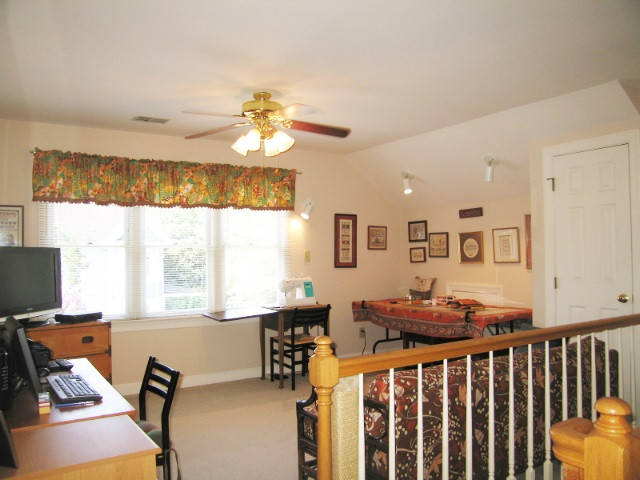 529 Watauga Street Raleigh, NC 27604 - Photo 11 of 24 The sellers use the south facing loft as a quilting studio.