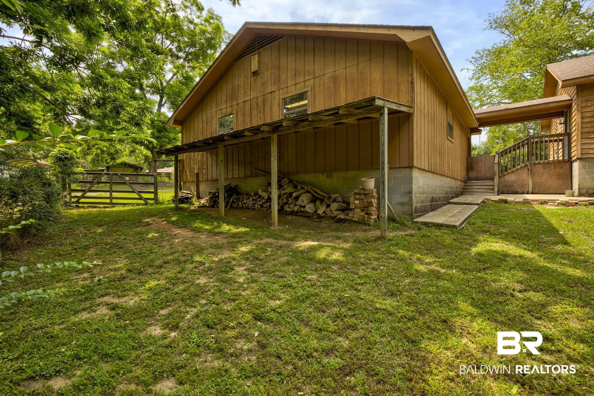 11350 Quinley Road Bay Minette, AL 36507 - Photo 38 of 42 Plenty of space behind the garage for Fire Wood Storage.
