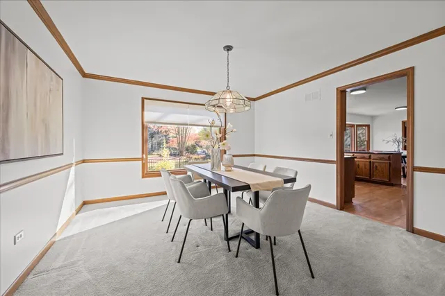 a dining room with furniture and window